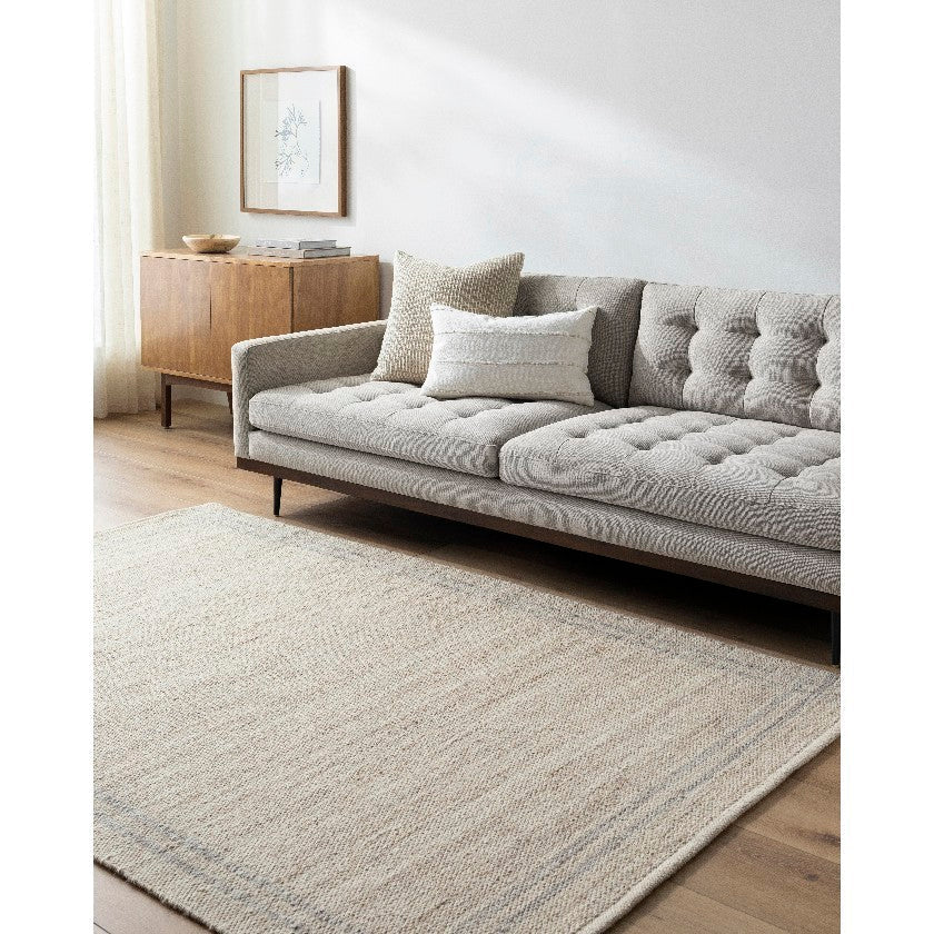 Janmichael Solid and Border Tan Area Rug